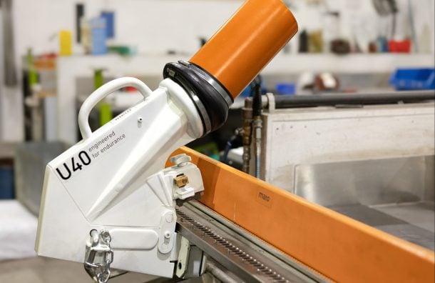 MATO U40 series tool mounted on conveyor belt fastener system in industrial workshop setting
